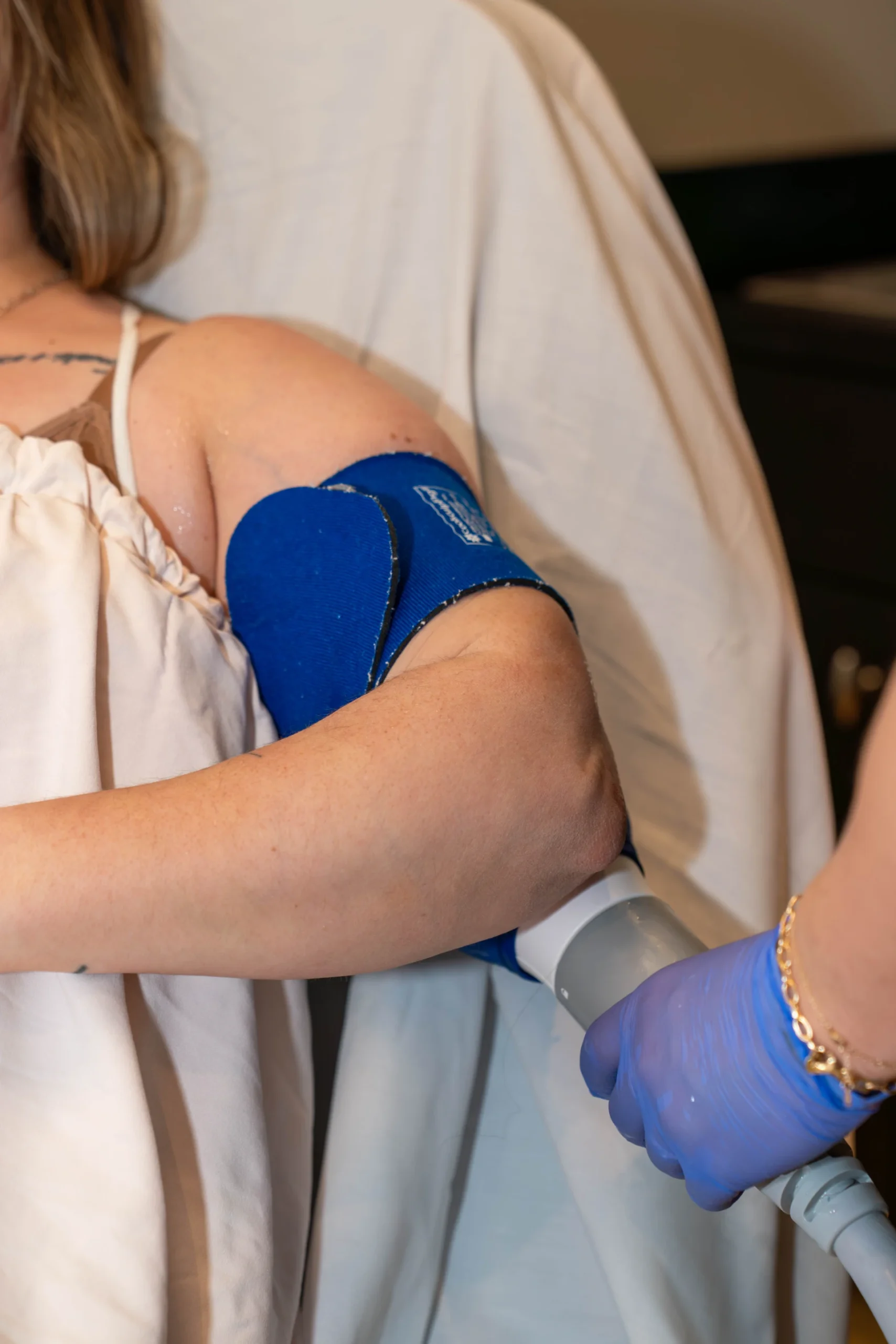 Woman considering fat reduction and muscle stimulation treatment for stubborn body areas Nashville